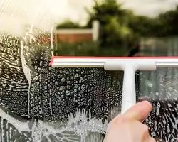 Professional hard water stain removal on luxury residential windows